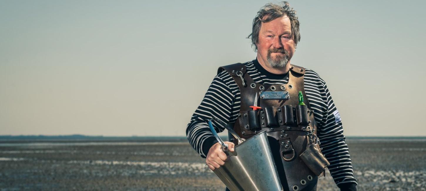 The Oyster King picking oysters in The Wadden Sea