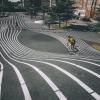 A cyclist speeds down the hill at Superkilen, Copenhagen, Denmark