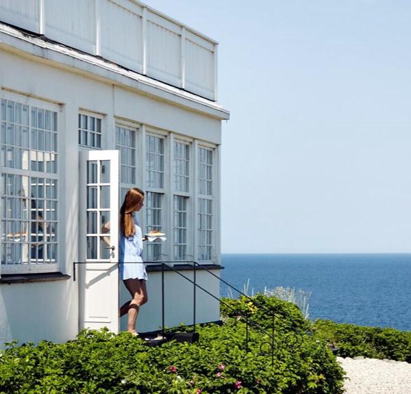 A woman walks out of Helenekilde Badehotel in North Zealand, Denmark