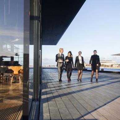 Business people walking at the Royal Danish Playhouse, Copenhagen