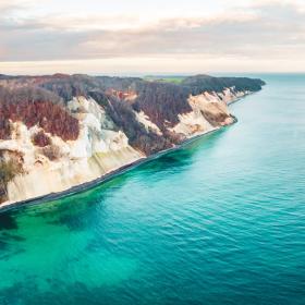 Møns Klint, a cliff in Southern Denmark, seen from above, with turquoise waters