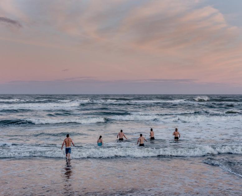 Winter bathers going into the water on a winter morning on Klitmoeller Beach in Thy, North Jutland